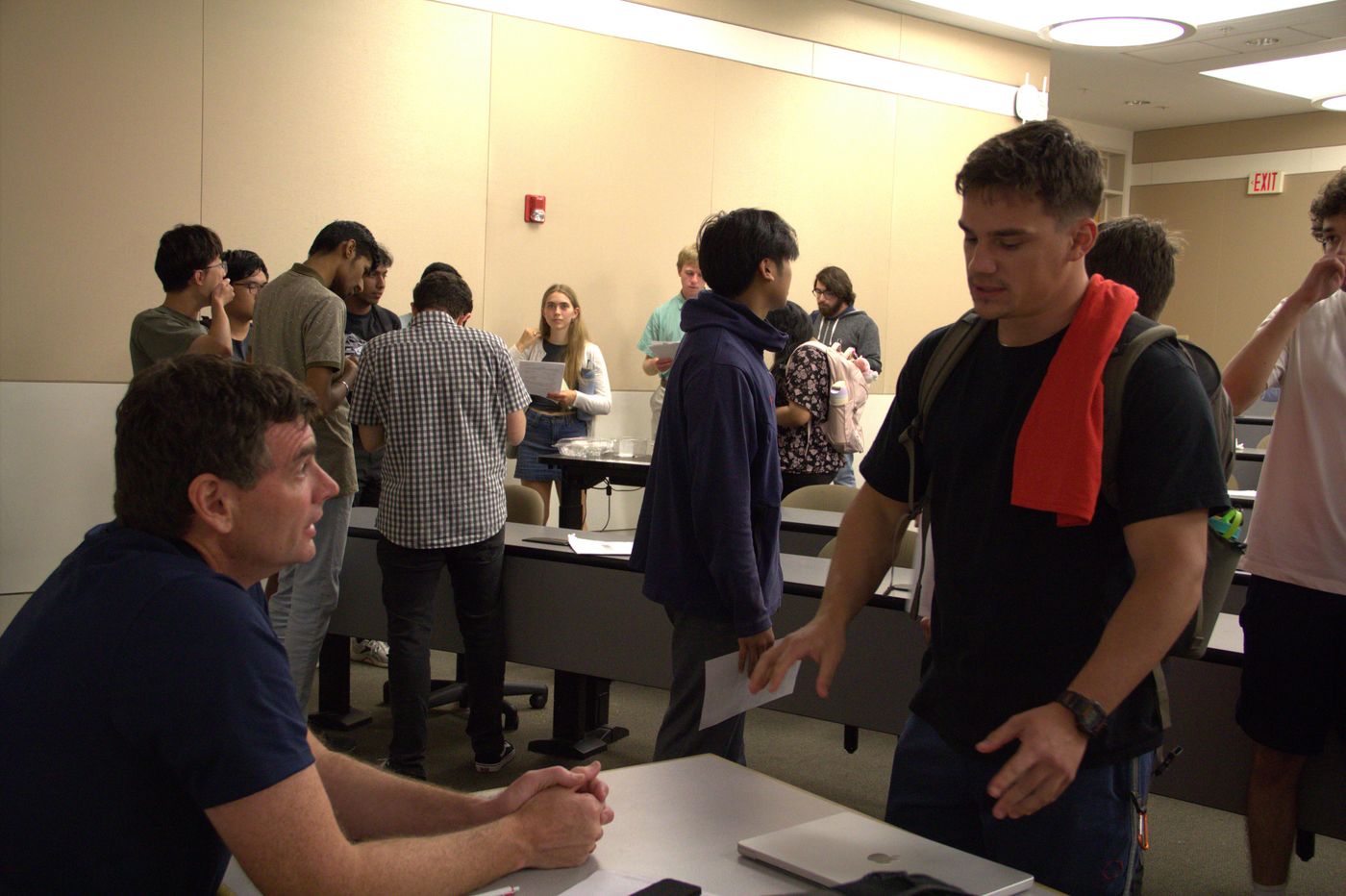 Attendees conversing with Hiring manager from ADI, Brain H., and amongst each other.