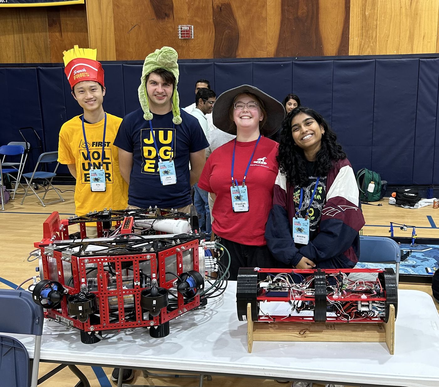 AquaPack members Eric L., Jack F., Elizabeth G., and Ankitha L. tabling at the scrimmage