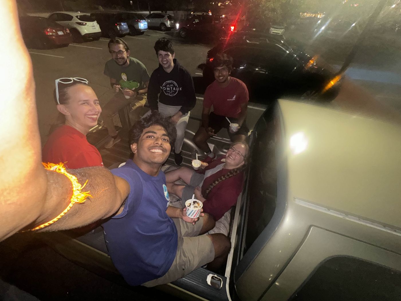 Abhi P. taking a selfie with other Aquapack members eating custard.
